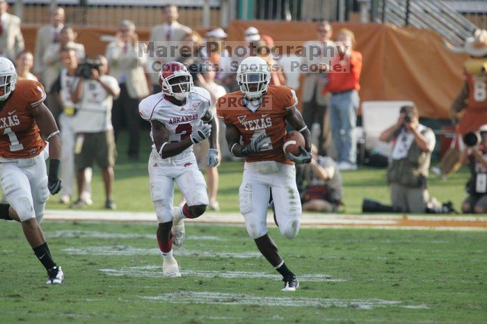 The University of Texas football team defeated the Arkansas Razorbacks with a score of 52-10 in Austin, TX on Saturday, September 27, 2008.

Filename: SRM_20080927_17161878.jpg
Aperture: f/5.6
Shutter Speed: 1/800
Body: Canon EOS-1D Mark II
Lens: Canon EF 300mm f/2.8 L IS