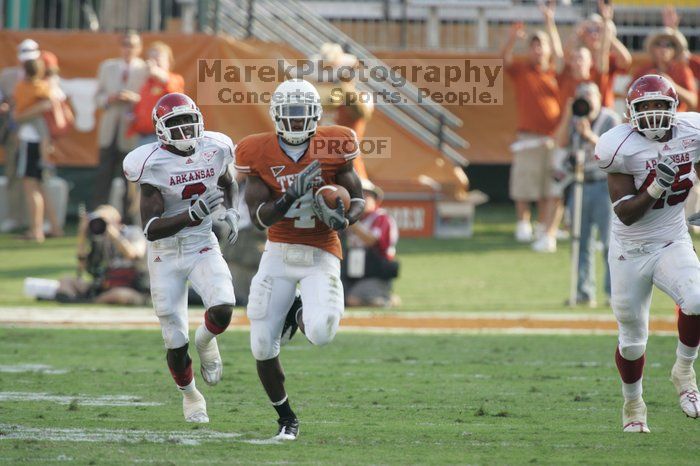 The University of Texas football team defeated the Arkansas Razorbacks with a score of 52-10 in Austin, TX on Saturday, September 27, 2008.

Filename: SRM_20080927_17161879.jpg
Aperture: f/5.6
Shutter Speed: 1/640
Body: Canon EOS-1D Mark II
Lens: Canon EF 300mm f/2.8 L IS