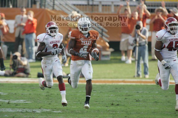 The University of Texas football team defeated the Arkansas Razorbacks with a score of 52-10 in Austin, TX on Saturday, September 27, 2008.

Filename: SRM_20080927_17162080.jpg
Aperture: f/5.6
Shutter Speed: 1/800
Body: Canon EOS-1D Mark II
Lens: Canon EF 300mm f/2.8 L IS