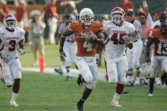 The University of Texas football team defeated the Arkansas Razorbacks with a score of 52-10 in Austin, TX on Saturday, September 27, 2008.

Filename: SRM_20080927_17162285.jpg
Aperture: f/5.6
Shutter Speed: 1/800
Body: Canon EOS-1D Mark II
Lens: Canon EF 300mm f/2.8 L IS