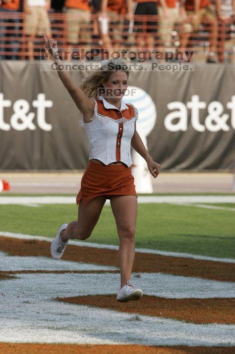 Texas Cheerleaders.  The University of Texas football team defeated the Arkansas Razorbacks with a score of 52-10 in Austin, TX on Saturday, September 27, 2008.

Filename: SRM_20080927_17182405.jpg
Aperture: f/5.6
Shutter Speed: 1/2000
Body: Canon EOS-1D Mark II
Lens: Canon EF 300mm f/2.8 L IS