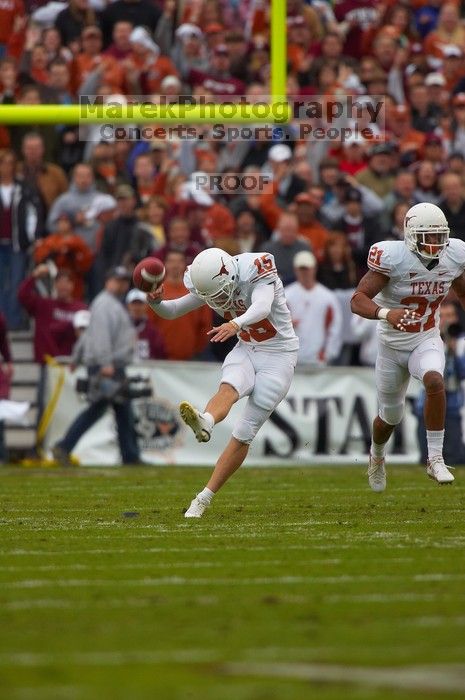 UT sophomore Hunter Lawrence (#15, K) kicks off against the Aggies.  The University of Texas, Austin played Texas A&M in football at Kyle Field, College Station, on November 23, 2007.  UT lost to the Aggies, 30 to 38.

Filename: SRM_20071123_1542064.jpg
Aperture: f/5.6
Shutter Speed: 1/1000
Body: Canon EOS-1D Mark II
Lens: Canon EF 300mm f/2.8 L IS