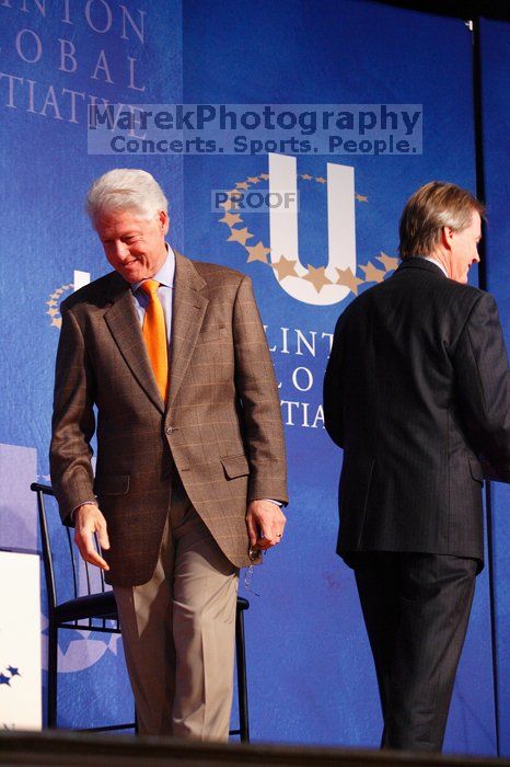 Former President Bill Clinton welcomes UT President William Powers Jr. to the stage.  Day one of the 2nd Annual Clinton Global Initiative University (CGIU) meeting was held at The University of Texas at Austin, Friday, February 13, 2009.

Filename: SRM_20090213_16293245.jpg
Aperture: f/4.0
Shutter Speed: 1/125
Body: Canon EOS-1D Mark II
Lens: Canon EF 80-200mm f/2.8 L