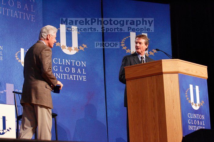 Former President Bill Clinton welcomes UT President William Powers Jr. to the stage.  Day one of the 2nd Annual Clinton Global Initiative University (CGIU) meeting was held at The University of Texas at Austin, Friday, February 13, 2009.

Filename: SRM_20090213_16293946.jpg
Aperture: f/4.0
Shutter Speed: 1/125
Body: Canon EOS-1D Mark II
Lens: Canon EF 80-200mm f/2.8 L