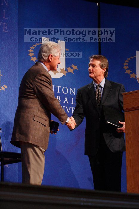 Former President Bill Clinton shakes hands with UT President William Powers Jr. after he spoke at the opening plenary session of the CGIU meeting.  Day one of the 2nd Annual Clinton Global Initiative University (CGIU) meeting was held at The University of Texas at Austin, Friday, February 13, 2009.

Filename: SRM_20090213_16354107.jpg
Aperture: f/4.0
Shutter Speed: 1/160
Body: Canon EOS-1D Mark II
Lens: Canon EF 80-200mm f/2.8 L