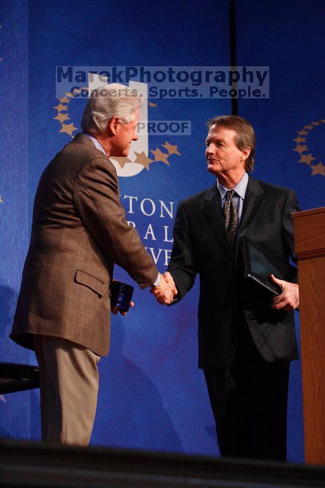 Former President Bill Clinton shakes hands with UT President William Powers Jr. after he spoke at the opening plenary session of the CGIU meeting.  Day one of the 2nd Annual Clinton Global Initiative University (CGIU) meeting was held at The University of Texas at Austin, Friday, February 13, 2009.

Filename: SRM_20090213_16354208.jpg
Aperture: f/4.0
Shutter Speed: 1/160
Body: Canon EOS-1D Mark II
Lens: Canon EF 80-200mm f/2.8 L