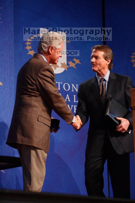 Former President Bill Clinton shakes hands with UT President William Powers Jr. after he spoke at the opening plenary session of the CGIU meeting.  Day one of the 2nd Annual Clinton Global Initiative University (CGIU) meeting was held at The University of Texas at Austin, Friday, February 13, 2009.

Filename: SRM_20090213_16354210.jpg
Aperture: f/4.0
Shutter Speed: 1/160
Body: Canon EOS-1D Mark II
Lens: Canon EF 80-200mm f/2.8 L