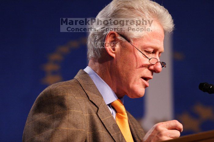 Former President Bill Clinton hands out commitment certificates to CGIU attendees for their exceptional pledges to the CGI cause during the opening plenary session of the CGIU meeting.  Day one of the 2nd Annual Clinton Global Initiative University (CGIU) meeting was held at The University of Texas at Austin, Friday, February 13, 2009.

Filename: SRM_20090213_16364663.jpg
Aperture: f/2.8
Shutter Speed: 1/200
Body: Canon EOS 20D
Lens: Canon EF 300mm f/2.8 L IS