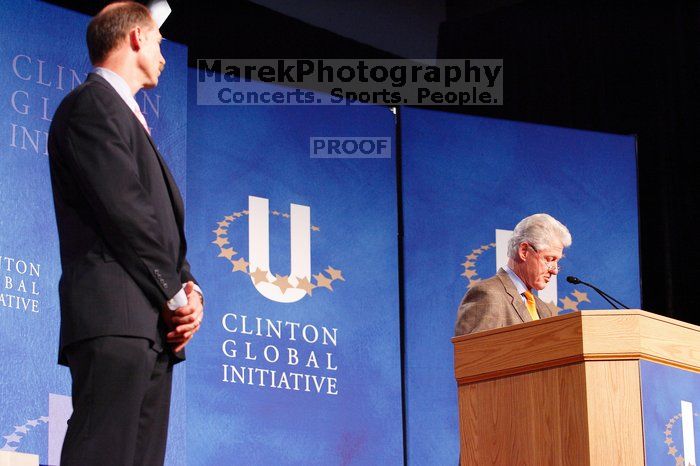 Former President Bill Clinton hands out commitment certificates to CGIU attendees for their exceptional pledges to the CGI cause during the opening plenary session of the CGIU meeting.  Day one of the 2nd Annual Clinton Global Initiative University (CGIU) meeting was held at The University of Texas at Austin, Friday, February 13, 2009.

Filename: SRM_20090213_16384426.jpg
Aperture: f/4.0
Shutter Speed: 1/100
Body: Canon EOS-1D Mark II
Lens: Canon EF 80-200mm f/2.8 L