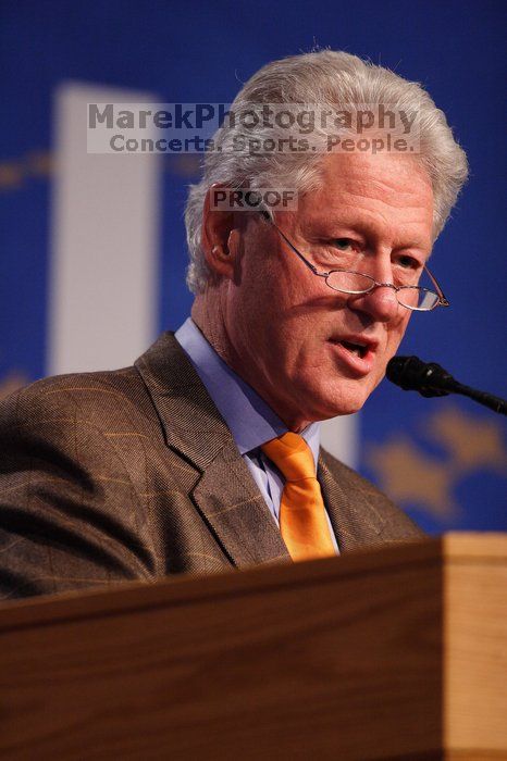 Former President Bill Clinton hands out commitment certificates to CGIU attendees for their exceptional pledges to the CGI cause during the opening plenary session of the CGIU meeting.  Day one of the 2nd Annual Clinton Global Initiative University (CGIU) meeting was held at The University of Texas at Austin, Friday, February 13, 2009.

Filename: SRM_20090213_16393774.jpg
Aperture: f/2.8
Shutter Speed: 1/320
Body: Canon EOS 20D
Lens: Canon EF 300mm f/2.8 L IS