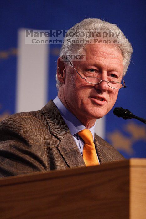 Former President Bill Clinton hands out commitment certificates to CGIU attendees for their exceptional pledges to the CGI cause during the opening plenary session of the CGIU meeting.  Day one of the 2nd Annual Clinton Global Initiative University (CGIU) meeting was held at The University of Texas at Austin, Friday, February 13, 2009.

Filename: SRM_20090213_16393976.jpg
Aperture: f/2.8
Shutter Speed: 1/320
Body: Canon EOS 20D
Lens: Canon EF 300mm f/2.8 L IS