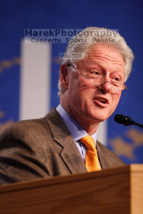 Former President Bill Clinton hands out commitment certificates to CGIU attendees for their exceptional pledges to the CGI cause during the opening plenary session of the CGIU meeting.  Day one of the 2nd Annual Clinton Global Initiative University (CGIU) meeting was held at The University of Texas at Austin, Friday, February 13, 2009.

Filename: SRM_20090213_16395189.jpg
Aperture: f/2.8
Shutter Speed: 1/250
Body: Canon EOS 20D
Lens: Canon EF 300mm f/2.8 L IS