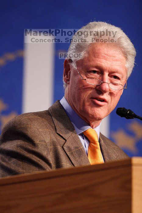 Former President Bill Clinton hands out commitment certificates to CGIU attendees for their exceptional pledges to the CGI cause during the opening plenary session of the CGIU meeting.  Day one of the 2nd Annual Clinton Global Initiative University (CGIU) meeting was held at The University of Texas at Austin, Friday, February 13, 2009.

Filename: SRM_20090213_16400294.jpg
Aperture: f/2.8
Shutter Speed: 1/250
Body: Canon EOS 20D
Lens: Canon EF 300mm f/2.8 L IS