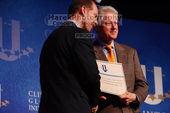 Former President Bill Clinton hands out commitment certificates to CGIU attendees for their exceptional pledges to the CGI cause during the opening plenary session of the CGIU meeting.  Day one of the 2nd Annual Clinton Global Initiative University (CGIU) meeting was held at The University of Texas at Austin, Friday, February 13, 2009.

Filename: SRM_20090213_16401645.jpg
Aperture: f/4.0
Shutter Speed: 1/200
Body: Canon EOS-1D Mark II
Lens: Canon EF 80-200mm f/2.8 L