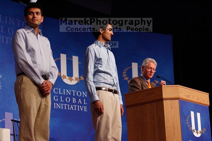 Former President Bill Clinton hands out commitment certificates to CGIU attendees for their exceptional pledges to the CGI cause during the opening plenary session of the CGIU meeting.  Day one of the 2nd Annual Clinton Global Initiative University (CGIU) meeting was held at The University of Texas at Austin, Friday, February 13, 2009.

Filename: SRM_20090213_16420964.jpg
Aperture: f/4.0
Shutter Speed: 1/160
Body: Canon EOS-1D Mark II
Lens: Canon EF 80-200mm f/2.8 L