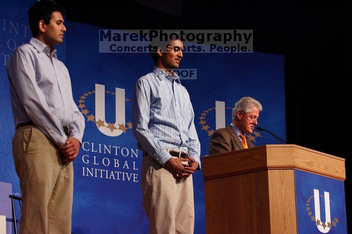 Former President Bill Clinton hands out commitment certificates to CGIU attendees for their exceptional pledges to the CGI cause during the opening plenary session of the CGIU meeting.  Day one of the 2nd Annual Clinton Global Initiative University (CGIU) meeting was held at The University of Texas at Austin, Friday, February 13, 2009.

Filename: SRM_20090213_16423068.jpg
Aperture: f/4.0
Shutter Speed: 1/200
Body: Canon EOS-1D Mark II
Lens: Canon EF 80-200mm f/2.8 L