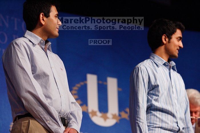 Former President Bill Clinton hands out commitment certificates to CGIU attendees for their exceptional pledges to the CGI cause during the opening plenary session of the CGIU meeting.  Day one of the 2nd Annual Clinton Global Initiative University (CGIU) meeting was held at The University of Texas at Austin, Friday, February 13, 2009.

Filename: SRM_20090213_16424577.jpg
Aperture: f/4.0
Shutter Speed: 1/160
Body: Canon EOS-1D Mark II
Lens: Canon EF 80-200mm f/2.8 L