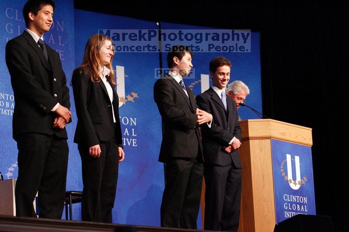 Former President Bill Clinton hands out commitment certificates to CGIU attendees for their exceptional pledges to the CGI cause during the opening plenary session of the CGIU meeting.  Day one of the 2nd Annual Clinton Global Initiative University (CGIU) meeting was held at The University of Texas at Austin, Friday, February 13, 2009.

Filename: SRM_20090213_16434297.jpg
Aperture: f/4.0
Shutter Speed: 1/100
Body: Canon EOS-1D Mark II
Lens: Canon EF 80-200mm f/2.8 L