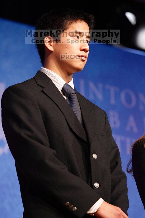 Former President Bill Clinton hands out commitment certificates to CGIU attendees for their exceptional pledges to the CGI cause during the opening plenary session of the CGIU meeting.  Day one of the 2nd Annual Clinton Global Initiative University (CGIU) meeting was held at The University of Texas at Austin, Friday, February 13, 2009.

Filename: SRM_20090213_16444004.jpg
Aperture: f/4.0
Shutter Speed: 1/60
Body: Canon EOS-1D Mark II
Lens: Canon EF 80-200mm f/2.8 L