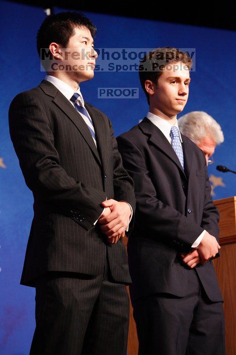 Former President Bill Clinton hands out commitment certificates to CGIU attendees for their exceptional pledges to the CGI cause during the opening plenary session of the CGIU meeting.  Day one of the 2nd Annual Clinton Global Initiative University (CGIU) meeting was held at The University of Texas at Austin, Friday, February 13, 2009.

Filename: SRM_20090213_16444606.jpg
Aperture: f/4.0
Shutter Speed: 1/100
Body: Canon EOS-1D Mark II
Lens: Canon EF 80-200mm f/2.8 L