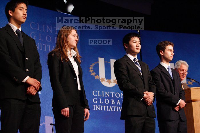 Former President Bill Clinton hands out commitment certificates to CGIU attendees for their exceptional pledges to the CGI cause during the opening plenary session of the CGIU meeting.  Day one of the 2nd Annual Clinton Global Initiative University (CGIU) meeting was held at The University of Texas at Austin, Friday, February 13, 2009.

Filename: SRM_20090213_16453412.jpg
Aperture: f/4.0
Shutter Speed: 1/125
Body: Canon EOS-1D Mark II
Lens: Canon EF 80-200mm f/2.8 L