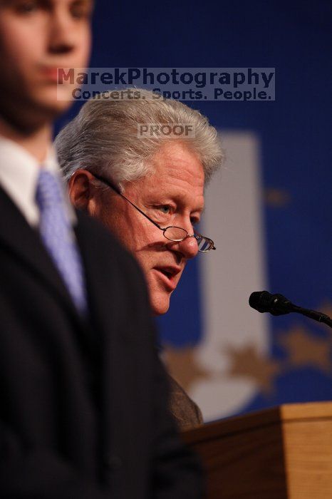 Former President Bill Clinton hands out commitment certificates to CGIU attendees for their exceptional pledges to the CGI cause during the opening plenary session of the CGIU meeting.  Day one of the 2nd Annual Clinton Global Initiative University (CGIU) meeting was held at The University of Texas at Austin, Friday, February 13, 2009.

Filename: SRM_20090213_16462313.jpg
Aperture: f/2.8
Shutter Speed: 1/400
Body: Canon EOS 20D
Lens: Canon EF 300mm f/2.8 L IS