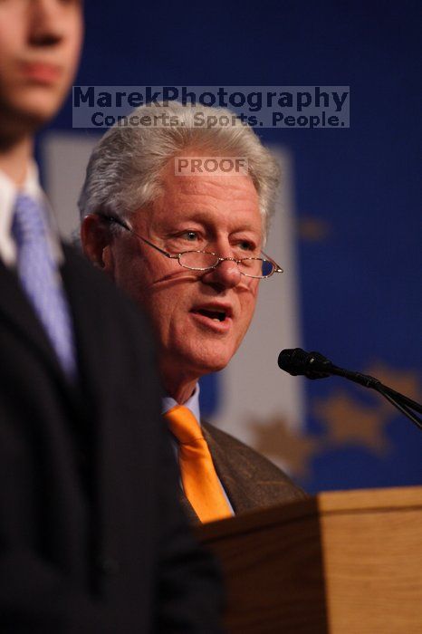 Former President Bill Clinton hands out commitment certificates to CGIU attendees for their exceptional pledges to the CGI cause during the opening plenary session of the CGIU meeting.  Day one of the 2nd Annual Clinton Global Initiative University (CGIU) meeting was held at The University of Texas at Austin, Friday, February 13, 2009.

Filename: SRM_20090213_16462414.jpg
Aperture: f/2.8
Shutter Speed: 1/400
Body: Canon EOS 20D
Lens: Canon EF 300mm f/2.8 L IS