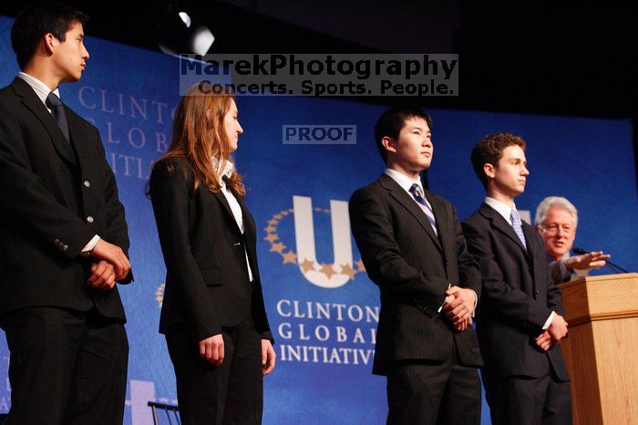 Former President Bill Clinton hands out commitment certificates to CGIU attendees for their exceptional pledges to the CGI cause during the opening plenary session of the CGIU meeting.  Day one of the 2nd Annual Clinton Global Initiative University (CGIU) meeting was held at The University of Texas at Austin, Friday, February 13, 2009.

Filename: SRM_20090213_16470922.jpg
Aperture: f/4.0
Shutter Speed: 1/100
Body: Canon EOS-1D Mark II
Lens: Canon EF 80-200mm f/2.8 L