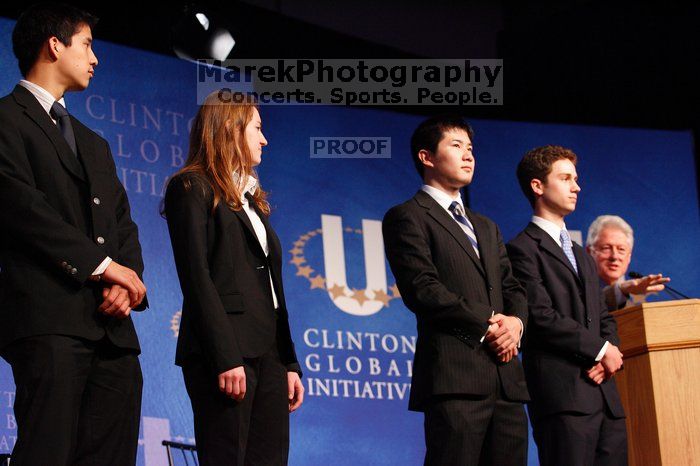 Former President Bill Clinton hands out commitment certificates to CGIU attendees for their exceptional pledges to the CGI cause during the opening plenary session of the CGIU meeting.  Day one of the 2nd Annual Clinton Global Initiative University (CGIU) meeting was held at The University of Texas at Austin, Friday, February 13, 2009.

Filename: SRM_20090213_16470923.jpg
Aperture: f/4.0
Shutter Speed: 1/100
Body: Canon EOS-1D Mark II
Lens: Canon EF 80-200mm f/2.8 L