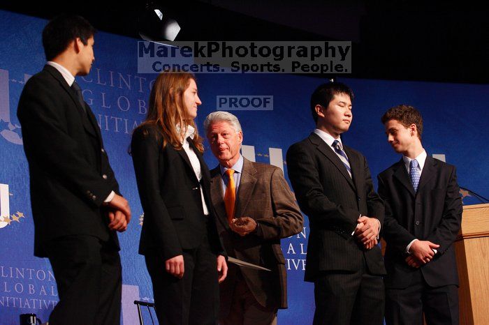 Former President Bill Clinton hands out commitment certificates to CGIU attendees for their exceptional pledges to the CGI cause during the opening plenary session of the CGIU meeting.  Day one of the 2nd Annual Clinton Global Initiative University (CGIU) meeting was held at The University of Texas at Austin, Friday, February 13, 2009.

Filename: SRM_20090213_16472526.jpg
Aperture: f/4.0
Shutter Speed: 1/125
Body: Canon EOS-1D Mark II
Lens: Canon EF 80-200mm f/2.8 L