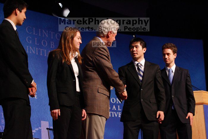 Former President Bill Clinton hands out commitment certificates to CGIU attendees for their exceptional pledges to the CGI cause during the opening plenary session of the CGIU meeting.  Day one of the 2nd Annual Clinton Global Initiative University (CGIU) meeting was held at The University of Texas at Austin, Friday, February 13, 2009.

Filename: SRM_20090213_16472932.jpg
Aperture: f/4.0
Shutter Speed: 1/125
Body: Canon EOS-1D Mark II
Lens: Canon EF 80-200mm f/2.8 L