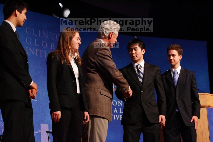 Former President Bill Clinton hands out commitment certificates to CGIU attendees for their exceptional pledges to the CGI cause during the opening plenary session of the CGIU meeting.  Day one of the 2nd Annual Clinton Global Initiative University (CGIU) meeting was held at The University of Texas at Austin, Friday, February 13, 2009.

Filename: SRM_20090213_16473033.jpg
Aperture: f/4.0
Shutter Speed: 1/125
Body: Canon EOS-1D Mark II
Lens: Canon EF 80-200mm f/2.8 L