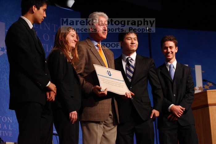 Former President Bill Clinton hands out commitment certificates to CGIU attendees for their exceptional pledges to the CGI cause during the opening plenary session of the CGIU meeting.  Day one of the 2nd Annual Clinton Global Initiative University (CGIU) meeting was held at The University of Texas at Austin, Friday, February 13, 2009.

Filename: SRM_20090213_16473439.jpg
Aperture: f/4.0
Shutter Speed: 1/160
Body: Canon EOS-1D Mark II
Lens: Canon EF 80-200mm f/2.8 L