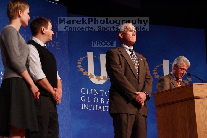 Former President Bill Clinton hands out commitment certificates to CGIU attendees for their exceptional pledges to the CGI cause during the opening plenary session of the CGIU meeting.  Day one of the 2nd Annual Clinton Global Initiative University (CGIU) meeting was held at The University of Texas at Austin, Friday, February 13, 2009.

Filename: SRM_20090213_16485360.jpg
Aperture: f/4.0
Shutter Speed: 1/160
Body: Canon EOS-1D Mark II
Lens: Canon EF 80-200mm f/2.8 L