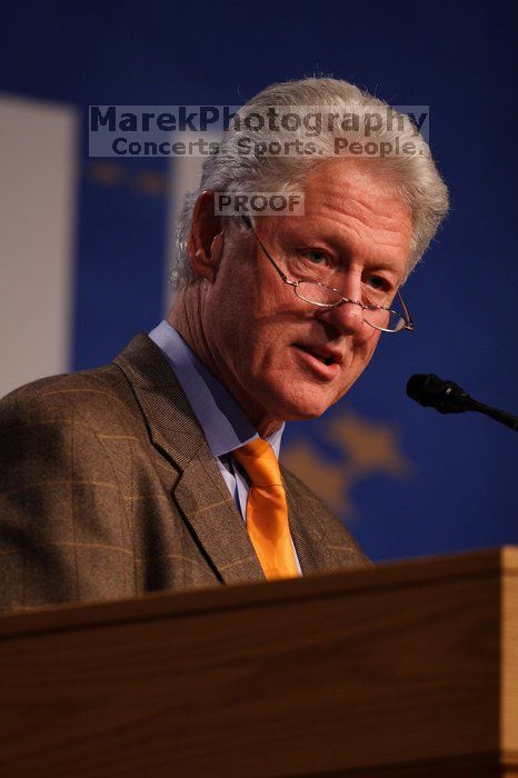 Former President Bill Clinton hands out commitment certificates to CGIU attendees for their exceptional pledges to the CGI cause during the opening plenary session of the CGIU meeting.  Day one of the 2nd Annual Clinton Global Initiative University (CGIU) meeting was held at The University of Texas at Austin, Friday, February 13, 2009.

Filename: SRM_20090213_16495121.jpg
Aperture: f/2.8
Shutter Speed: 1/320
Body: Canon EOS 20D
Lens: Canon EF 300mm f/2.8 L IS