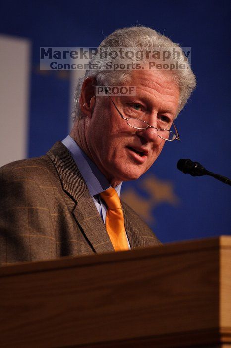 Former President Bill Clinton hands out commitment certificates to CGIU attendees for their exceptional pledges to the CGI cause during the opening plenary session of the CGIU meeting.  Day one of the 2nd Annual Clinton Global Initiative University (CGIU) meeting was held at The University of Texas at Austin, Friday, February 13, 2009.

Filename: SRM_20090213_16495222.jpg
Aperture: f/2.8
Shutter Speed: 1/320
Body: Canon EOS 20D
Lens: Canon EF 300mm f/2.8 L IS