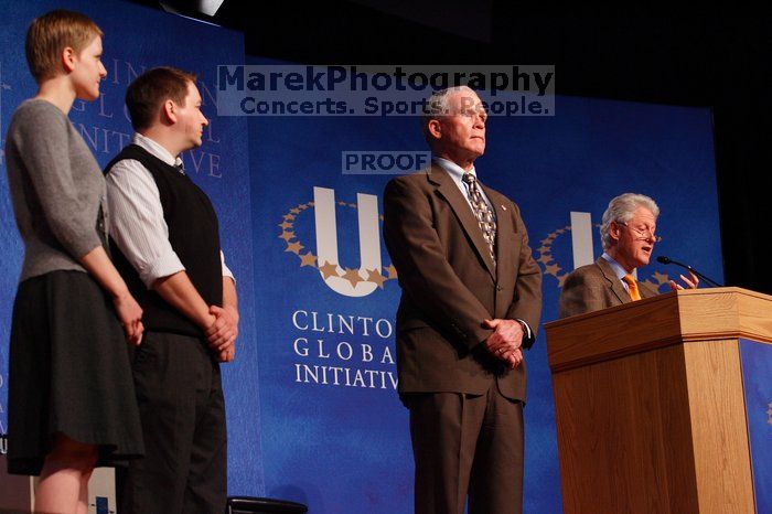 Former President Bill Clinton hands out commitment certificates to CGIU attendees for their exceptional pledges to the CGI cause during the opening plenary session of the CGIU meeting.  Day one of the 2nd Annual Clinton Global Initiative University (CGIU) meeting was held at The University of Texas at Austin, Friday, February 13, 2009.

Filename: SRM_20090213_16502769.jpg
Aperture: f/4.0
Shutter Speed: 1/160
Body: Canon EOS-1D Mark II
Lens: Canon EF 80-200mm f/2.8 L