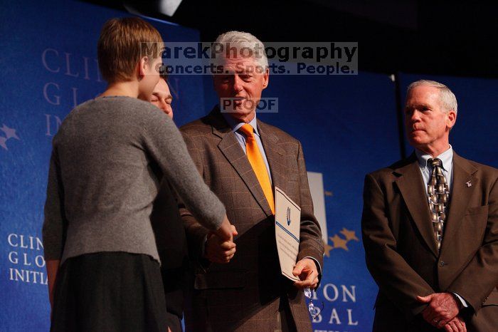 Former President Bill Clinton hands out commitment certificates to CGIU attendees for their exceptional pledges to the CGI cause during the opening plenary session of the CGIU meeting.  Day one of the 2nd Annual Clinton Global Initiative University (CGIU) meeting was held at The University of Texas at Austin, Friday, February 13, 2009.

Filename: SRM_20090213_16504979.jpg
Aperture: f/4.0
Shutter Speed: 1/200
Body: Canon EOS-1D Mark II
Lens: Canon EF 80-200mm f/2.8 L