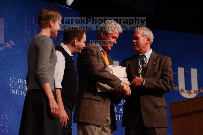 Former President Bill Clinton hands out commitment certificates to CGIU attendees for their exceptional pledges to the CGI cause during the opening plenary session of the CGIU meeting.  Day one of the 2nd Annual Clinton Global Initiative University (CGIU) meeting was held at The University of Texas at Austin, Friday, February 13, 2009.

Filename: SRM_20090213_16505484.jpg
Aperture: f/4.0
Shutter Speed: 1/200
Body: Canon EOS-1D Mark II
Lens: Canon EF 80-200mm f/2.8 L