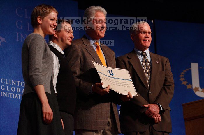 Former President Bill Clinton hands out commitment certificates to CGIU attendees for their exceptional pledges to the CGI cause during the opening plenary session of the CGIU meeting.  Day one of the 2nd Annual Clinton Global Initiative University (CGIU) meeting was held at The University of Texas at Austin, Friday, February 13, 2009.

Filename: SRM_20090213_16505888.jpg
Aperture: f/4.0
Shutter Speed: 1/250
Body: Canon EOS-1D Mark II
Lens: Canon EF 80-200mm f/2.8 L