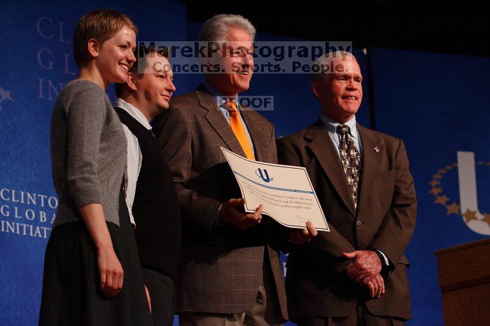 Former President Bill Clinton hands out commitment certificates to CGIU attendees for their exceptional pledges to the CGI cause during the opening plenary session of the CGIU meeting.  Day one of the 2nd Annual Clinton Global Initiative University (CGIU) meeting was held at The University of Texas at Austin, Friday, February 13, 2009.

Filename: SRM_20090213_16505889.jpg
Aperture: f/4.0
Shutter Speed: 1/250
Body: Canon EOS-1D Mark II
Lens: Canon EF 80-200mm f/2.8 L