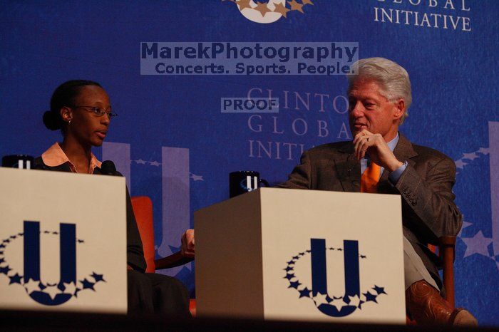 Mambidzeni Madzivire (L), BME graduate student at Mayo Graduate School, and Former President Bill Clinton (R) at the opening plenary session of the CGIU meeting.  Day one of the 2nd Annual Clinton Global Initiative University (CGIU) meeting was held at The University of Texas at Austin, Friday, February 13, 2009.

Filename: SRM_20090213_16580746.jpg
Aperture: f/4.5
Shutter Speed: 1/320
Body: Canon EOS-1D Mark II
Lens: Canon EF 80-200mm f/2.8 L