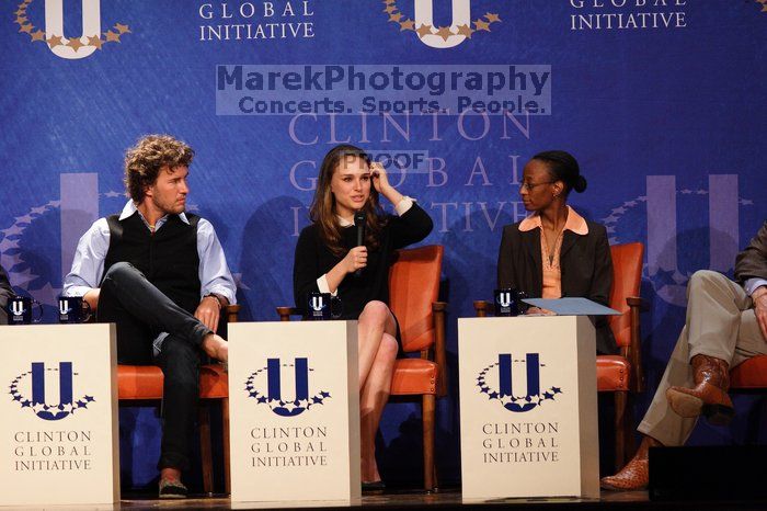 Blake Mycoskie (1-L), founder of TOMS shoes, Natalie Portman (2-L), Mambidzeni Madzivire (2-R), BME graduate student at Mayo Graduate School, and Former President Bill Clinton (1-R) at the first plenary session of the CGIU meeting.  Day one of the 2nd Annual Clinton Global Initiative University (CGIU) meeting was held at The University of Texas at Austin, Friday, February 13, 2009.

Filename: SRM_20090213_17025002.jpg
Aperture: f/4.0
Shutter Speed: 1/200
Body: Canon EOS 20D
Lens: Canon EF 300mm f/2.8 L IS