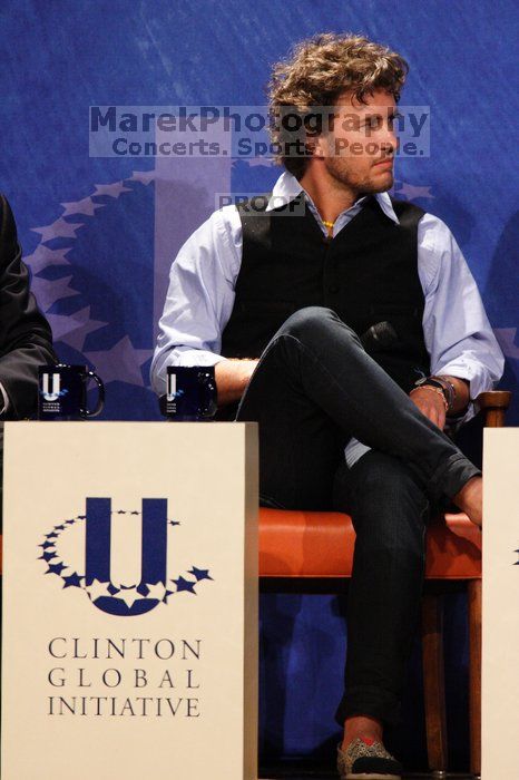 Blake Mycoskie, founder of TOMS shoes, donates one pair of shoes to a third world country for every pair of shoes they sell.  Day one of the 2nd Annual Clinton Global Initiative University (CGIU) meeting was held at The University of Texas at Austin, Friday, February 13, 2009.

Filename: SRM_20090213_17084254.jpg
Aperture: f/5.6
Shutter Speed: 1/250
Body: Canon EOS 20D
Lens: Canon EF 300mm f/2.8 L IS