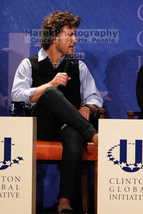 Blake Mycoskie, founder of TOMS shoes, donates one pair of shoes to a third world country for every pair of shoes they sell.  Day one of the 2nd Annual Clinton Global Initiative University (CGIU) meeting was held at The University of Texas at Austin, Friday, February 13, 2009.

Filename: SRM_20090213_17103974.jpg
Aperture: f/5.6
Shutter Speed: 1/250
Body: Canon EOS 20D
Lens: Canon EF 300mm f/2.8 L IS