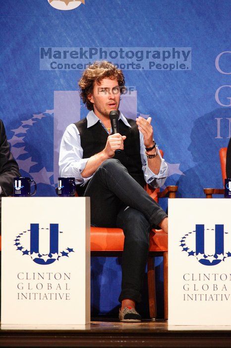 Blake Mycoskie, founder of TOMS shoes, donates one pair of shoes to a third world country for every pair of shoes they sell.  Day one of the 2nd Annual Clinton Global Initiative University (CGIU) meeting was held at The University of Texas at Austin, Friday, February 13, 2009.

Filename: SRM_20090213_17121468.jpg
Aperture: f/5.6
Shutter Speed: 1/100
Body: Canon EOS-1D Mark II
Lens: Canon EF 300mm f/2.8 L IS