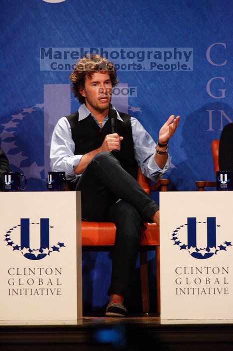 Blake Mycoskie, founder of TOMS shoes, donates one pair of shoes to a third world country for every pair of shoes they sell.  Day one of the 2nd Annual Clinton Global Initiative University (CGIU) meeting was held at The University of Texas at Austin, Friday, February 13, 2009.

Filename: SRM_20090213_17131780.jpg
Aperture: f/5.6
Shutter Speed: 1/250
Body: Canon EOS-1D Mark II
Lens: Canon EF 300mm f/2.8 L IS