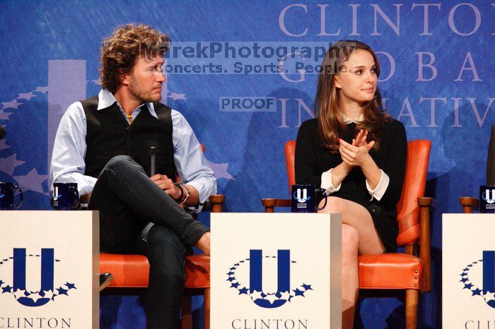 Blake Mycoskie (L), founder of TOMS shoes, and Natalie Portman (R) at the first plenary session of the CGIU meeting.  Day one of the 2nd Annual Clinton Global Initiative University (CGIU) meeting was held at The University of Texas at Austin, Friday, February 13, 2009.

Filename: SRM_20090213_17164018.jpg
Aperture: f/5.6
Shutter Speed: 1/200
Body: Canon EOS-1D Mark II
Lens: Canon EF 300mm f/2.8 L IS