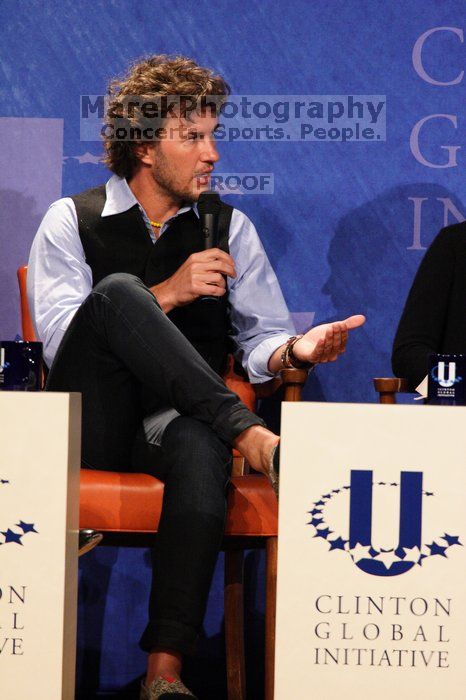 Blake Mycoskie, founder of TOMS shoes, donates one pair of shoes to a third world country for every pair of shoes they sell.  Day one of the 2nd Annual Clinton Global Initiative University (CGIU) meeting was held at The University of Texas at Austin, Friday, February 13, 2009.

Filename: SRM_20090213_17341501.jpg
Aperture: f/5.6
Shutter Speed: 1/200
Body: Canon EOS 20D
Lens: Canon EF 300mm f/2.8 L IS