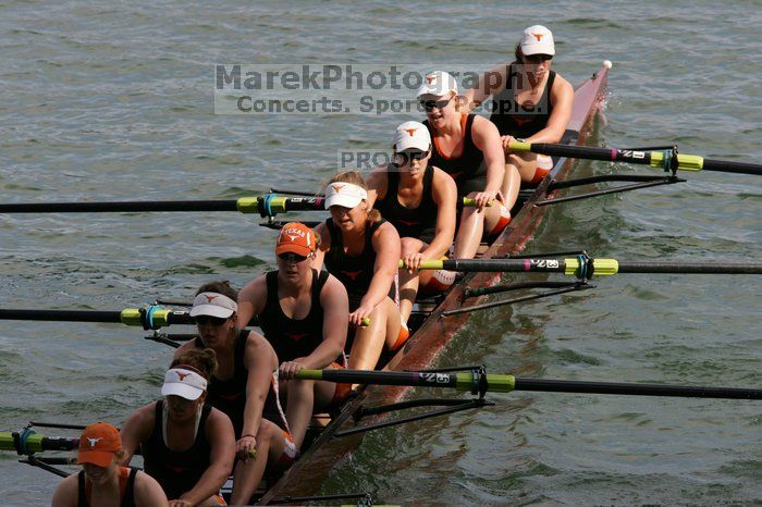 The Texas Rowing first varsity eight team, with coxswain Mary Cait McPherson, stroke Jen VanderMaarel, Felicia Izaguirre-Werner, Meg George, Nancy Arrington, Jelena Zunic, Karli Sheahan, Colleen Irby and Sara Cottingham, finished with a time of 7:09.3, losing to Wisconsin, which completed the race in 7:01.1. This was the third session of the Longhorn Invitational, Saturday afternoon, March 21, 2009 on Lady Bird Lake.

Filename: SRM_20090321_16355836.jpg
Aperture: f/8.0
Shutter Speed: 1/1000
Body: Canon EOS-1D Mark II
Lens: Canon EF 300mm f/2.8 L IS